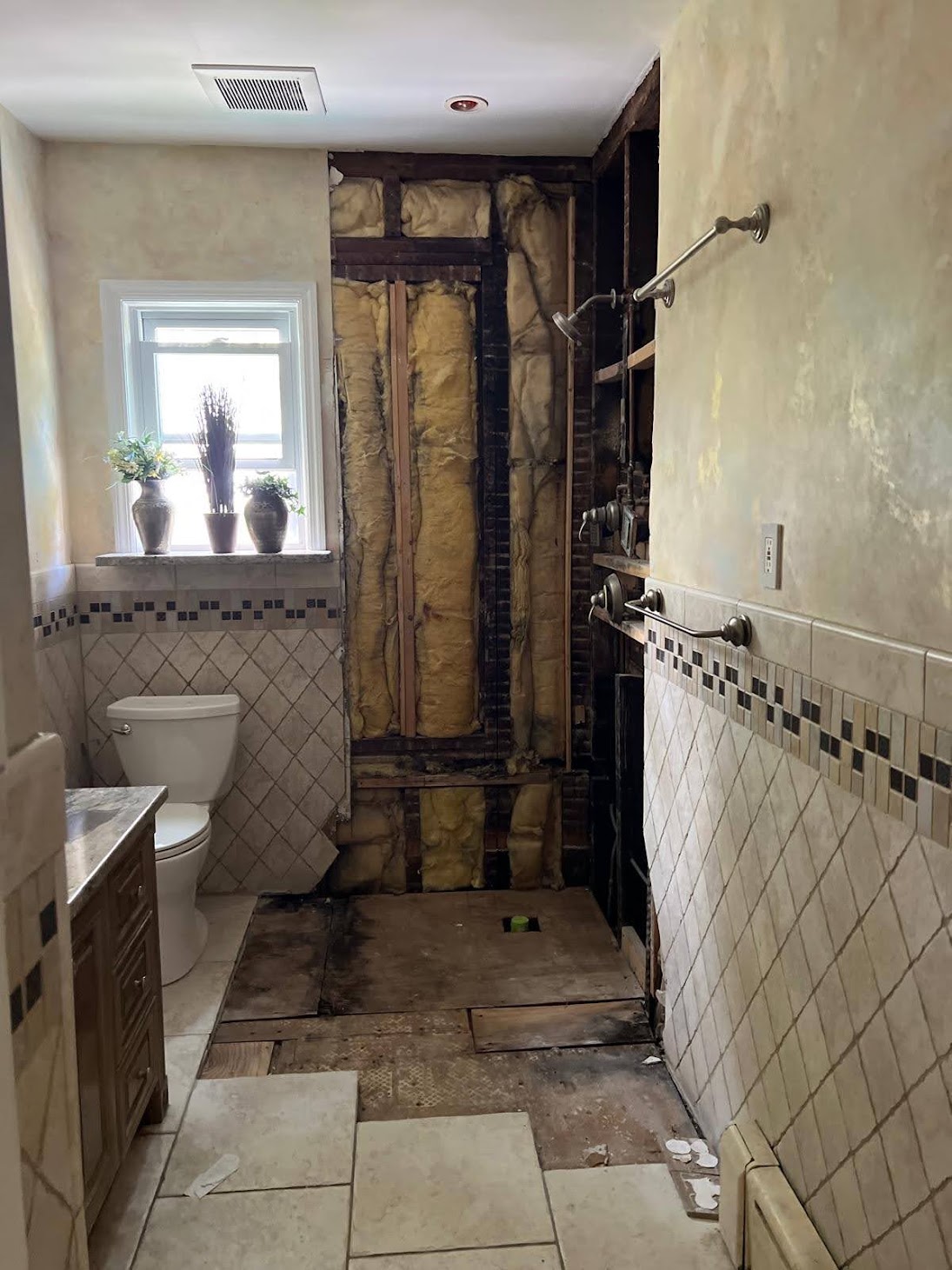 Kellets selective bathroom demolition exposing concealed wall and floor conditions