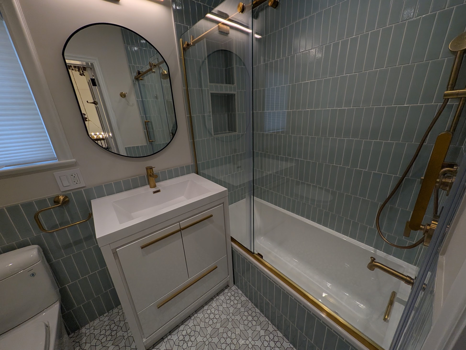 Completed blue tile bathroom renovation by Kellets in Westchester