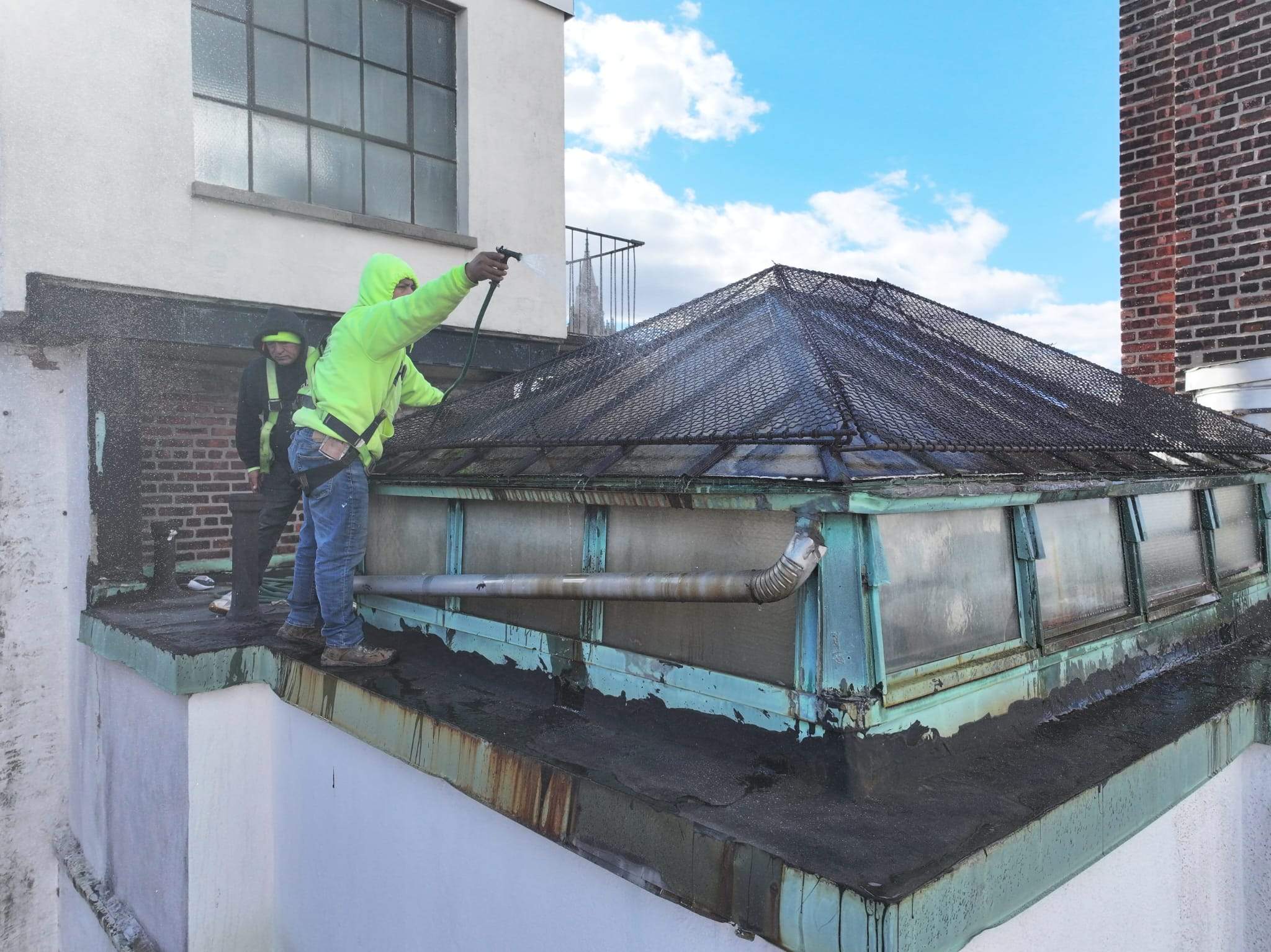 Crew conducting a targeted skylight water test at a Brooklyn multifamily property