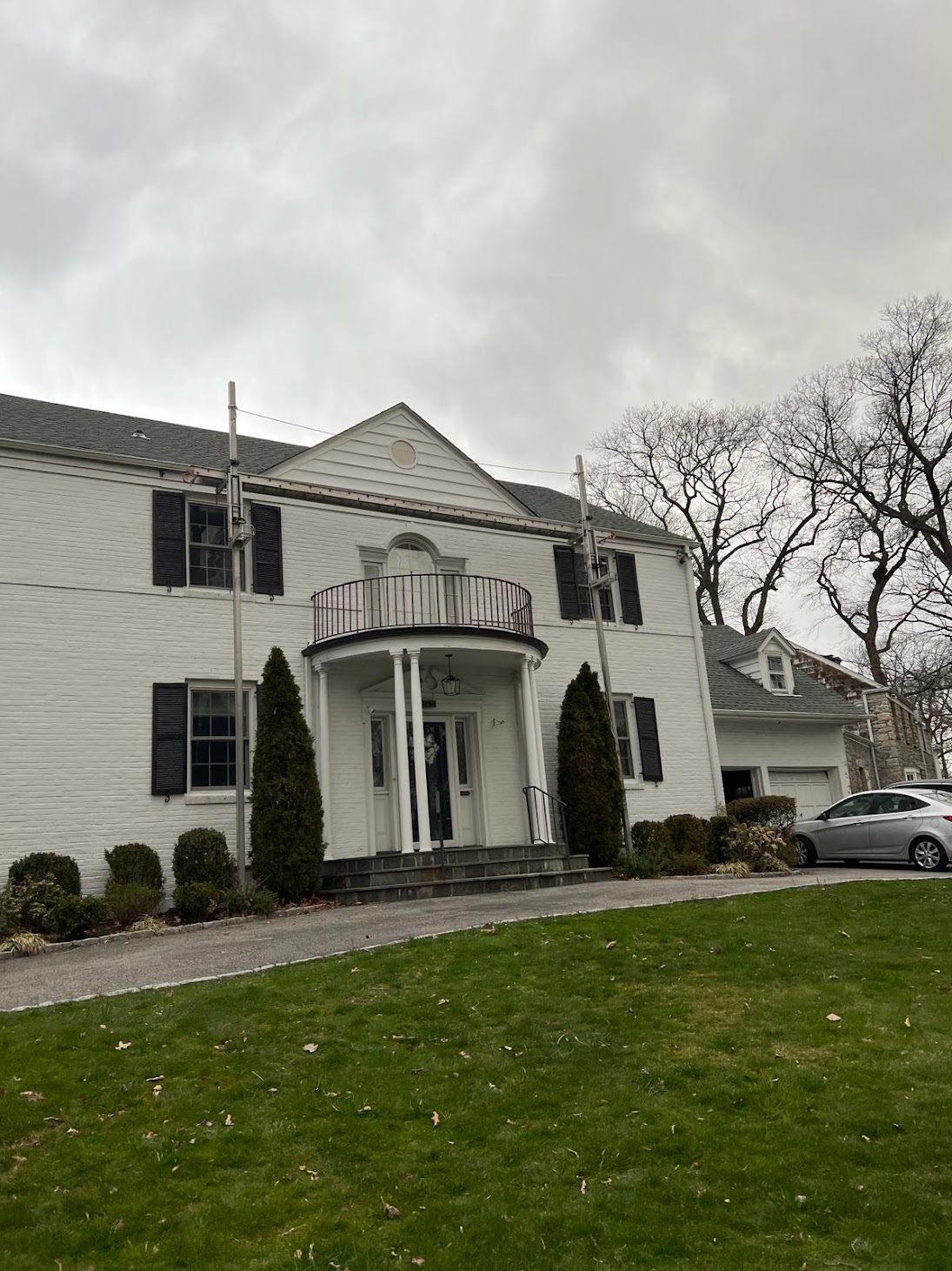 Original exterior condition of a Scarsdale whole-home renovation before expansion work
