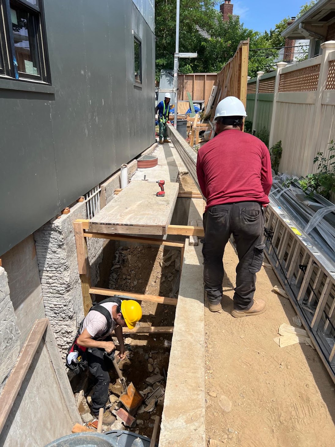 Kellets crew creating safe exterior access for foundation and water-management work