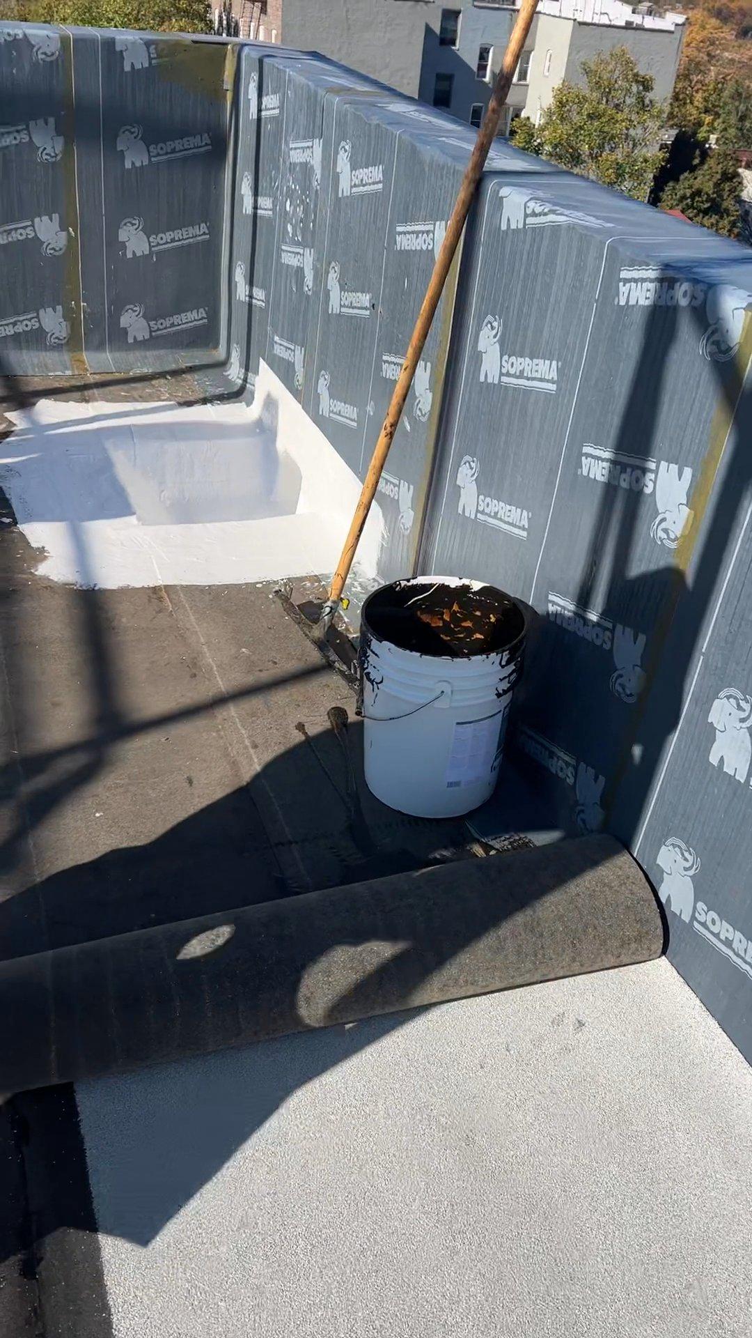 SOPREMA parapet membrane and reinforced liquid flashing documented during Kellets installation